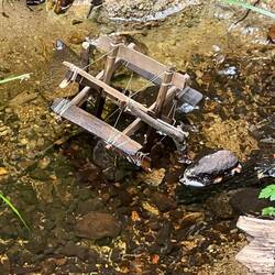 Tiny paddle wheel somebody built and placed in the creek.