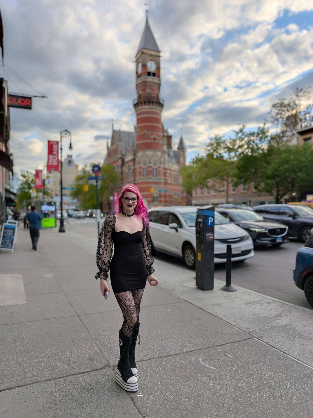 A branch of the New York Public library in the background. It was formerly a courthouse.
