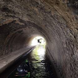 One of many narrow tunnels that needed to be dug under modern infrastructure to restore the canal