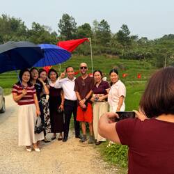 A group of Chinese tourists hijaked Lilz to join them in their group photo!