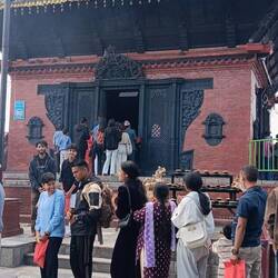 Worshippers (bare feet) at the summit's temple