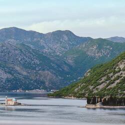 our Lady on the rock + manmade island for church in middle of Fjord view