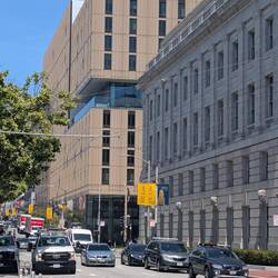 James' uni is the brownish building in the corner. His school is on the yellow banner sign.