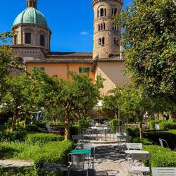 Best place to photograph the dome and bell tower of the Duomo is Giardino Rasponi.