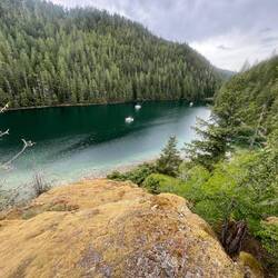 View from my hike up the rock hill of Roscoe Bay inner cove and our boats.