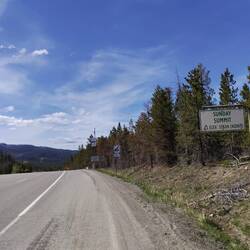 Another summit! You know you've climbed big when they put a sign atop.