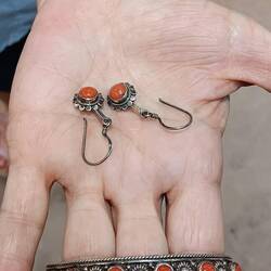 Shopping for jewelry.  Anna bought the earrings.