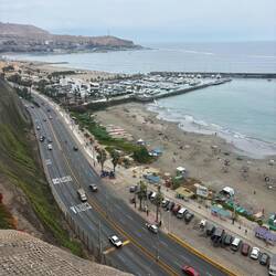 Coastal views of surfers below