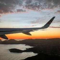 Flying over Ibiza at sunset