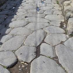 Ruts in the street from wagons and chariots