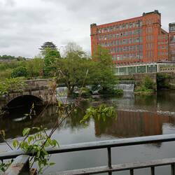 One of the Strutt mills with weir and sluice gates that powered it