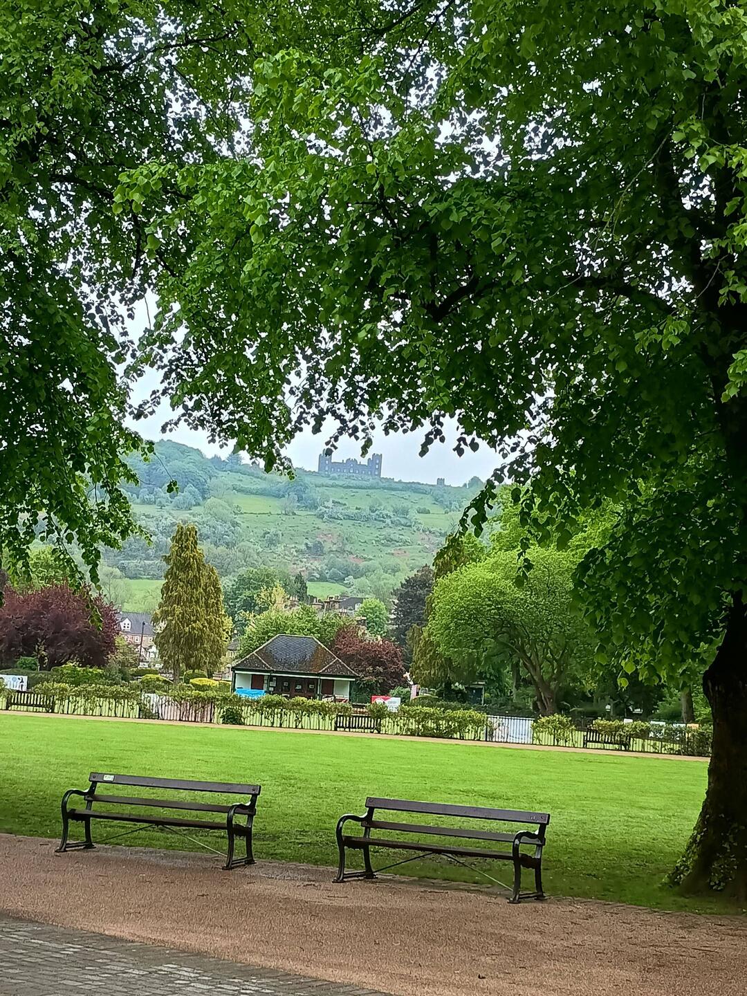The classic view up to Riber Castle framed by fresh spring greenery