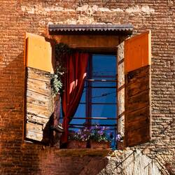 Window on a medieval-tower-turned-B&B — Bologna, Italy.