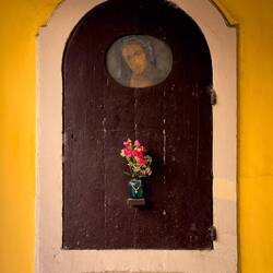 Shrine at the end of a portico — Bologna, Italy.