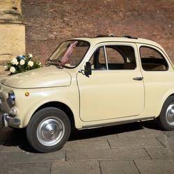 A cute Fiat Cinquecento dressed up for the wedding ... Piazza Maggiore — Bologna, Italy.