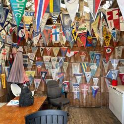 All kinds of flags hanging in the Lagoon Cove Marina barn