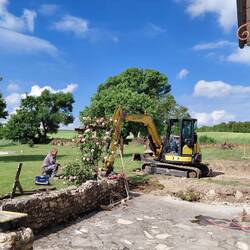The rose arbour is chopped off to make room for investigating the pipes