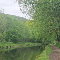 Rainboat's rear moored just past the bend. Lovely to see hills beyond the trees