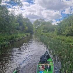 Rural view on the journey but the rubbish is piling up in the canoe due to lack of bins
