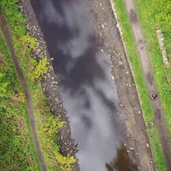 Drone shot with the clouds reflected in the water