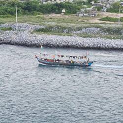 Fishing boats on the way out to fish over night. As usual, washing drying on the superstructure.