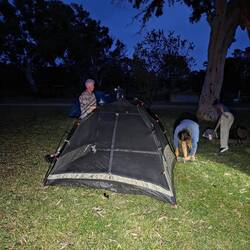 Pitching tents as dark falls