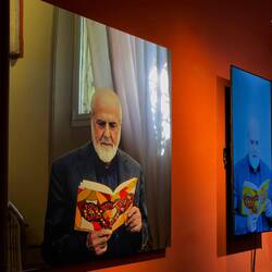Pistoletto's self-portrait on mirror; and AI generated reading of the book in his hand.