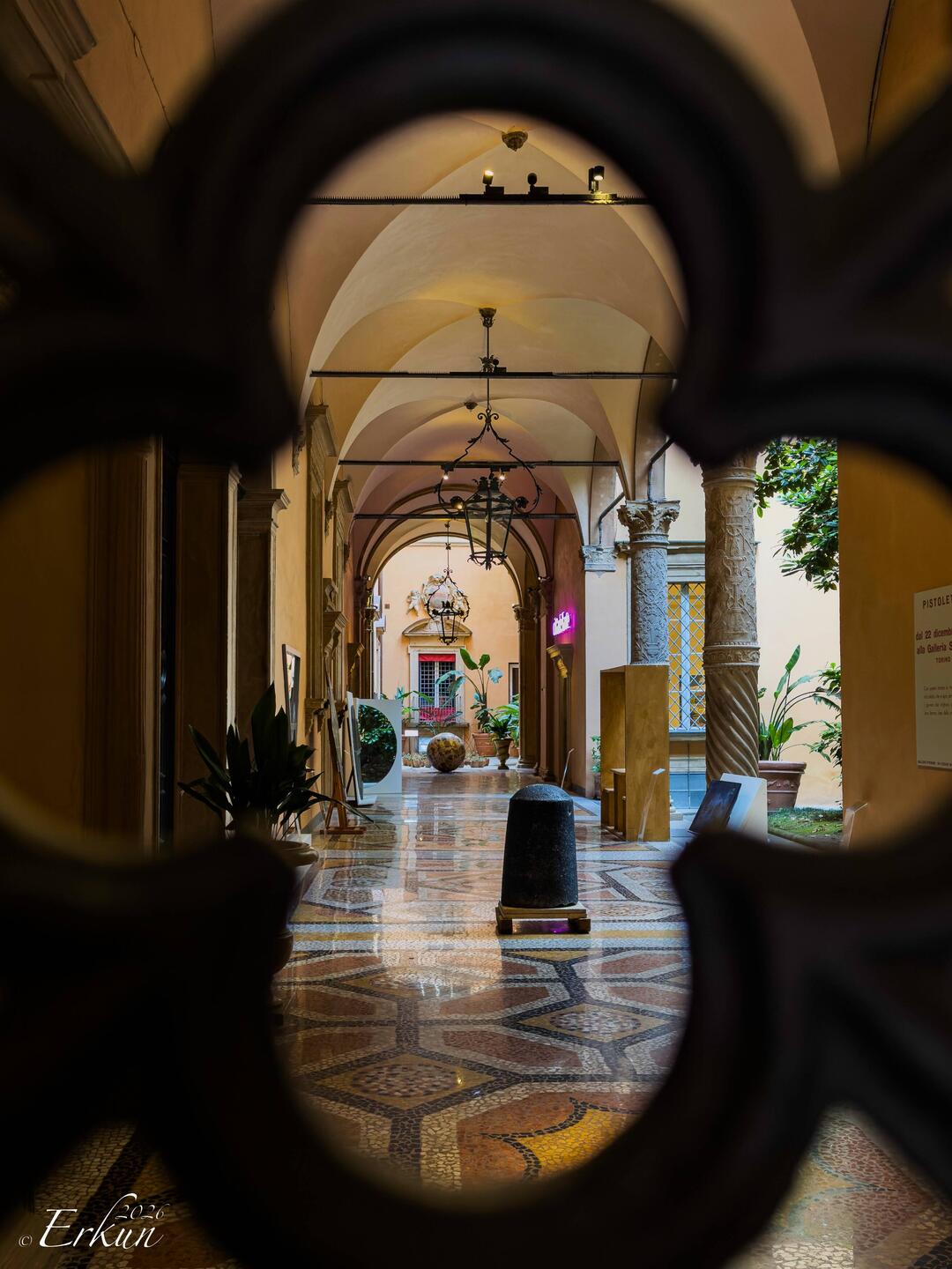 Loggia through the wrought-iron gate ... Palazzo Boncompagni — Bologna, Italy.