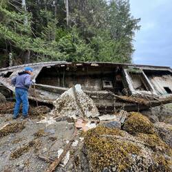 Bill checking out the old boat hull