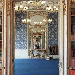 Inside the mansion; a clever design of door frame size is "reflected" in one mirror at the end