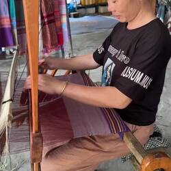 Shuttle run by a local weaver lady