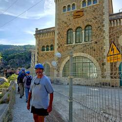Tom in front of one of the power plant buildings.