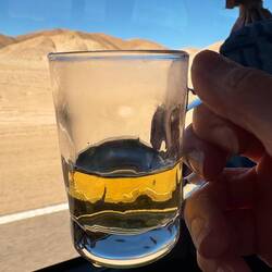 Drinking coco tea in the van to ward off altitude sickness