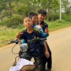 Schoolboys on bikes full of cheeky bravado