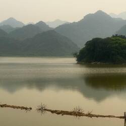 A large reservoir, fringed by Cuc Phuong national park’s green mountains, calmed us.