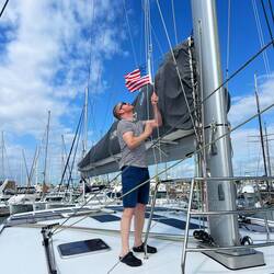 Patricks's first action in America: hoist the courtesey flag!
