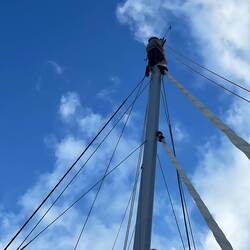 New crew gets a free hoist to the mast top!