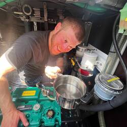 Patrick installing additional check valves in the bilge-pump hoses.