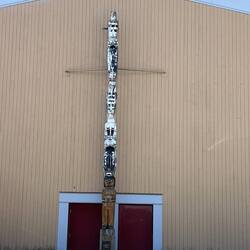 Totem pole in front of Bella Bella school