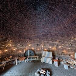 Interior of round house, dome of sticks