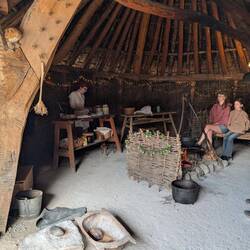 Food preparation, grain grinding in the stone bowl