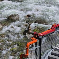 Faucet is huge piece of art project along a full city block of the river