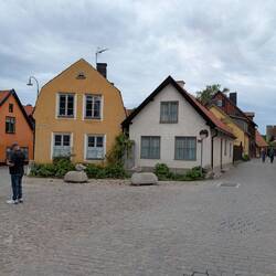 Clean streets, just wide enough for cars to use. All cobblestone roads.