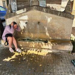 Missy cooling down in the fountain. It was a hot road walk the last couple of miles.