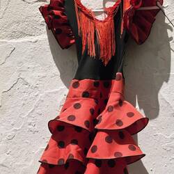 Little-girl Flamenco dress hanging outside a shop in Arcos.