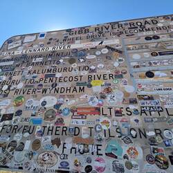 People leave stickers from their trip, advertising their business or reflecting where they are from.