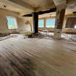 Inside hotel. Had a nice wood floor, at one time...