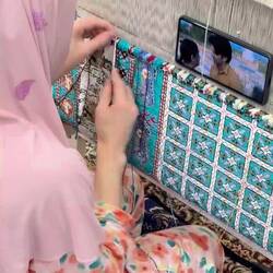 Very fast knotting and thread-cutting--her knife has a tiny hook