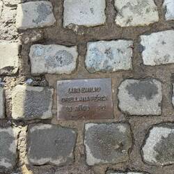 Stones listing the names, ages, and party of people killed by torture