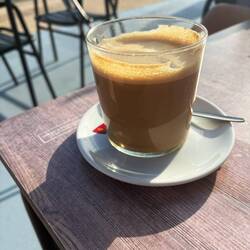 Coffee at a table outside the hotel. Despite the hotel being named Camino de Santiago.